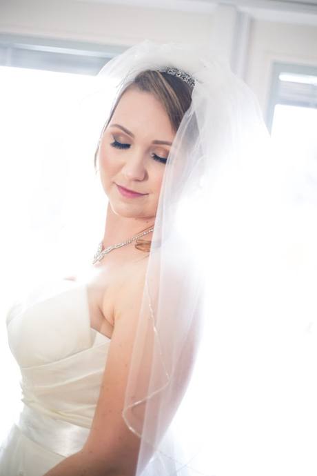 Soft natural-light portrait of a Penticton bride wearing a veil and tiara